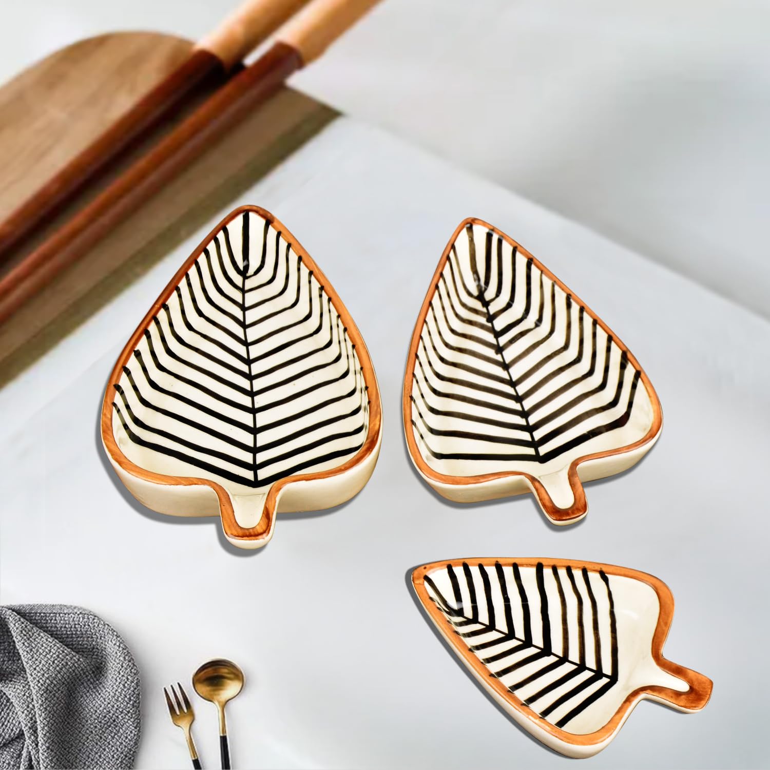 Leaf Shaped Hand Painted Ceramic Glossy Tray - Set Of 3, White, Black Lines | For Serving Cookies, Dry Fruits, Sweets & Snacks, Length – 16 Cm, 15 Cm & 12 Cm | Small Platter Set Leaf Shaped Hand Painted Ceramic Glossy Tray - Set Of 3, White, Black Lines | For Serving Cookies, Dry Fruits, Sweets & Snacks, Length – 16 Cm, 15 Cm & 12 Cm | Small Platter Set